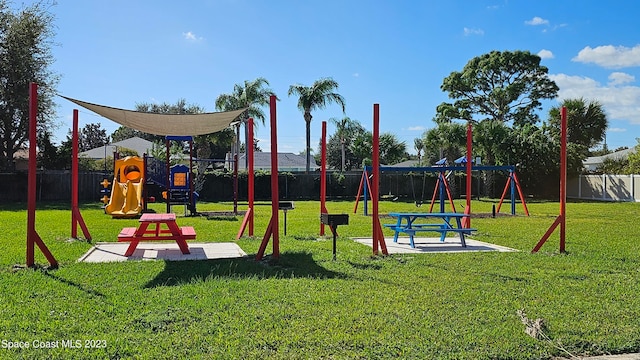 view of play area featuring a lawn