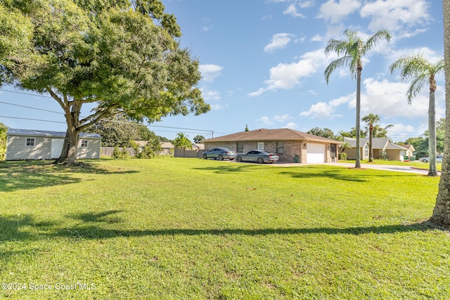 view of yard with a garage