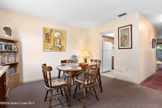 view of carpeted dining area