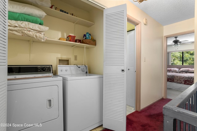 washroom with a textured ceiling, light colored carpet, ceiling fan, and washing machine and clothes dryer