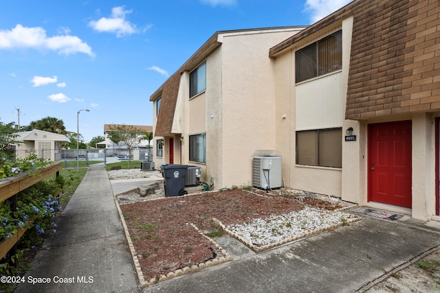 view of side of property with central AC unit