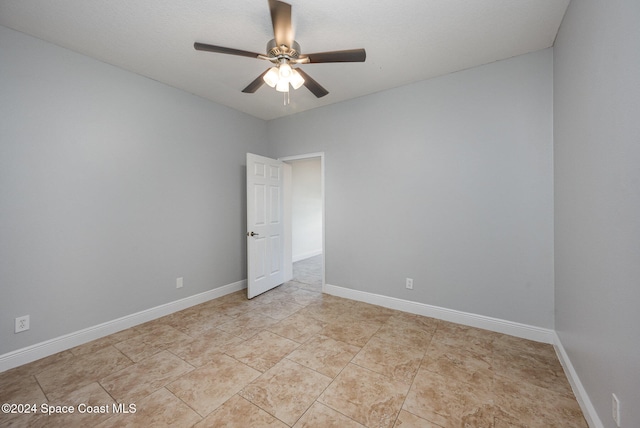 spare room featuring ceiling fan