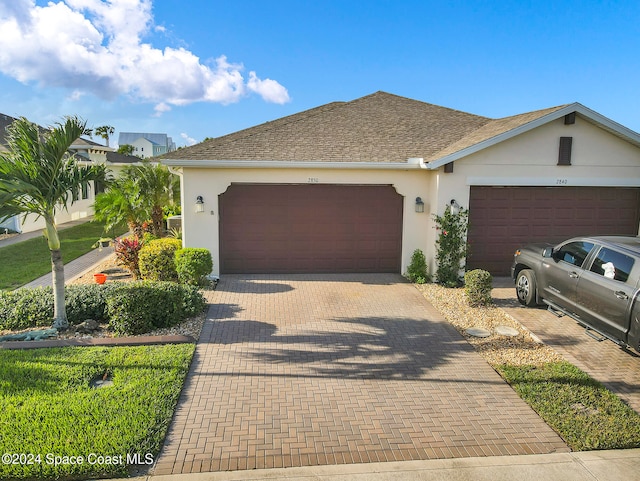 single story home with a garage