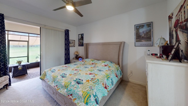 bedroom with ceiling fan and light carpet