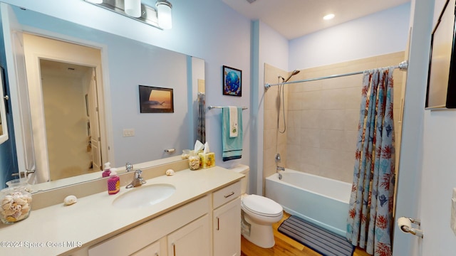 full bathroom featuring shower / bath combo, toilet, wood-type flooring, and vanity