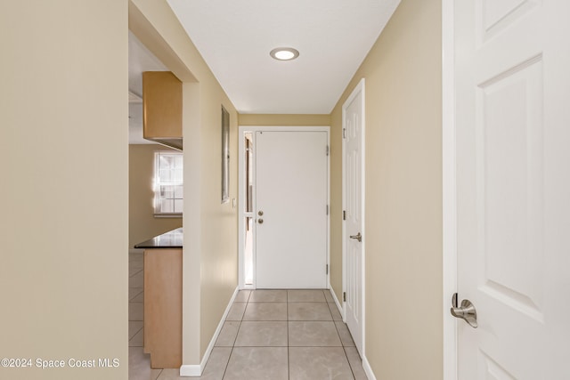 corridor featuring light tile patterned flooring