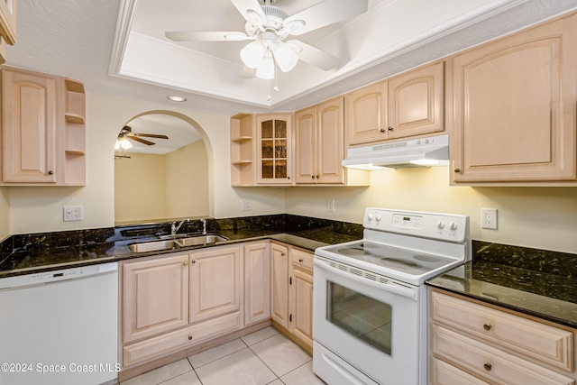 kitchen featuring white appliances, sink, and light brown cabinetry