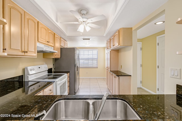 kitchen featuring sink, light brown cabinets, dark stone countertops, white range with electric cooktop, and light tile patterned flooring