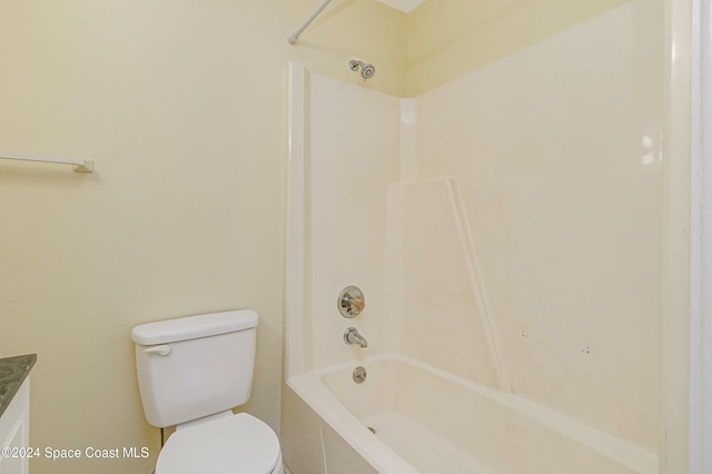 bathroom featuring shower / tub combination and toilet