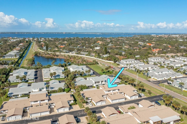 birds eye view of property featuring a water view