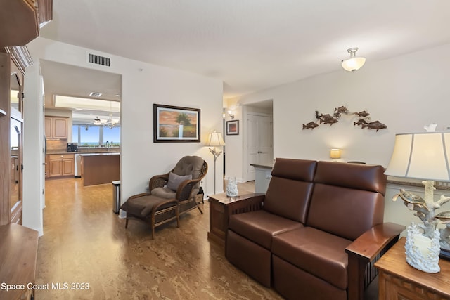 living room featuring a chandelier and wood-type flooring