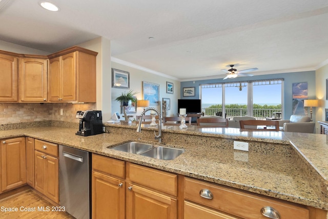 kitchen featuring dishwasher, light stone counters, ornamental molding, and sink