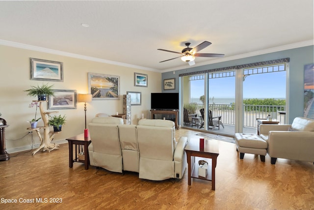 living room featuring hardwood / wood-style flooring, ceiling fan, and ornamental molding