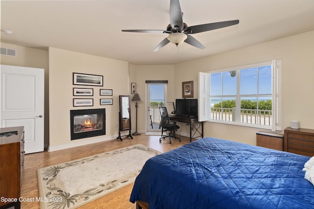 bedroom with light wood-type flooring and ceiling fan