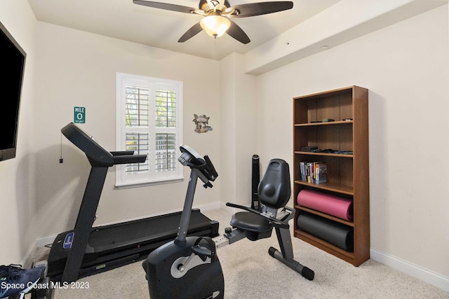 exercise area with light carpet and ceiling fan