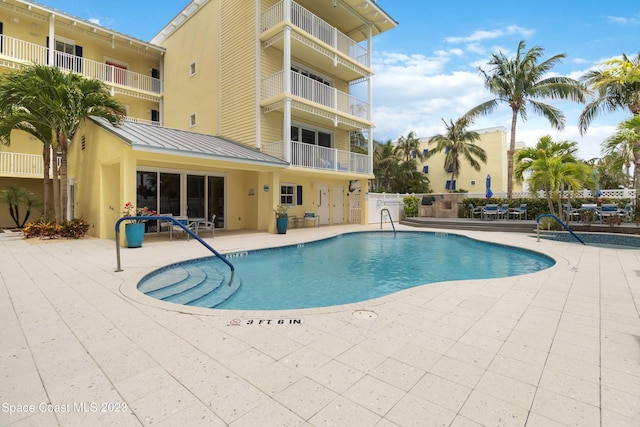 view of pool featuring a patio