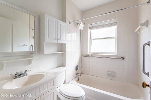 full bathroom with vanity, toilet, and tiled shower / bath