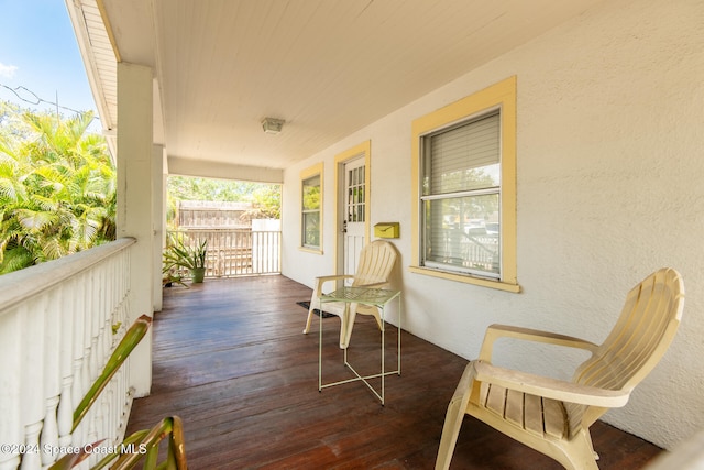 wooden terrace featuring a porch