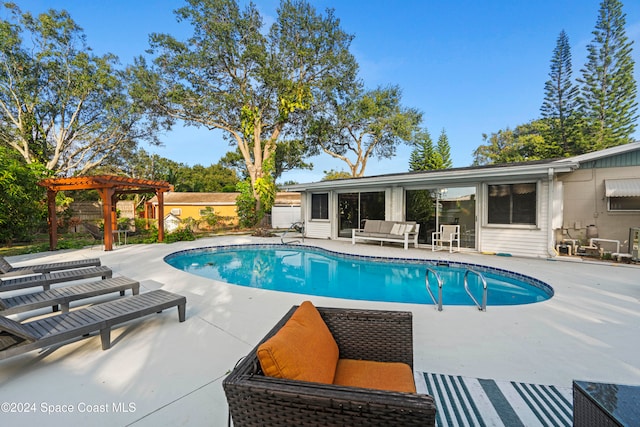 view of swimming pool featuring an outdoor living space, a patio area, and a pergola