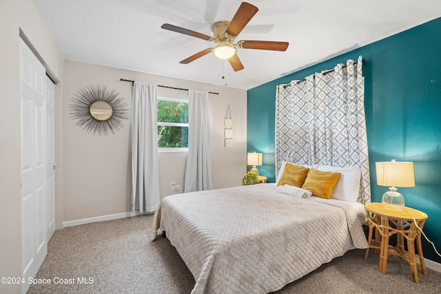 carpeted bedroom with a closet and ceiling fan