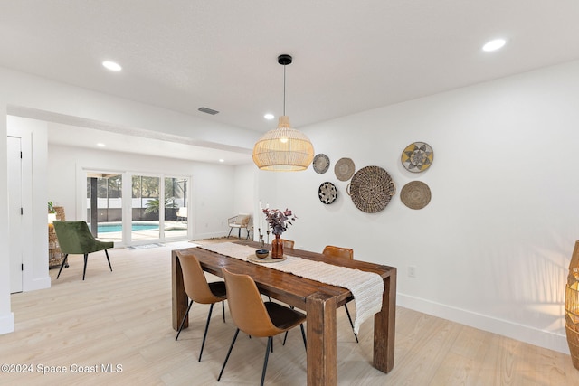 dining room with light hardwood / wood-style flooring