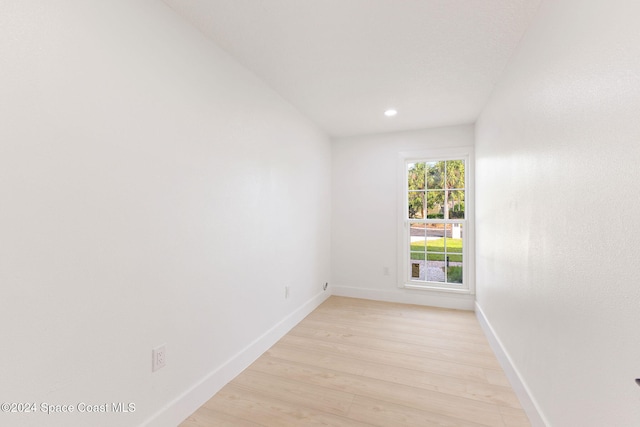 spare room featuring light hardwood / wood-style flooring