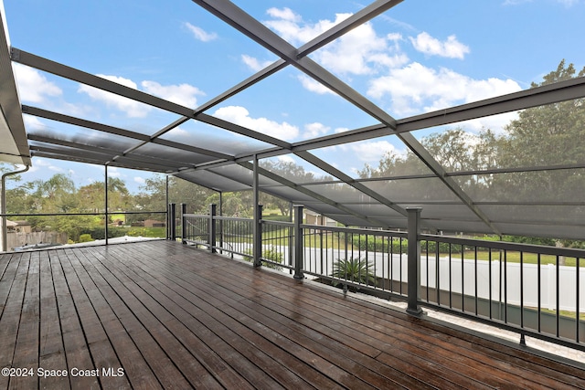 wooden terrace featuring a water view