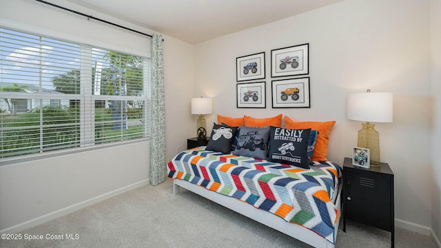 bedroom with carpet and baseboards