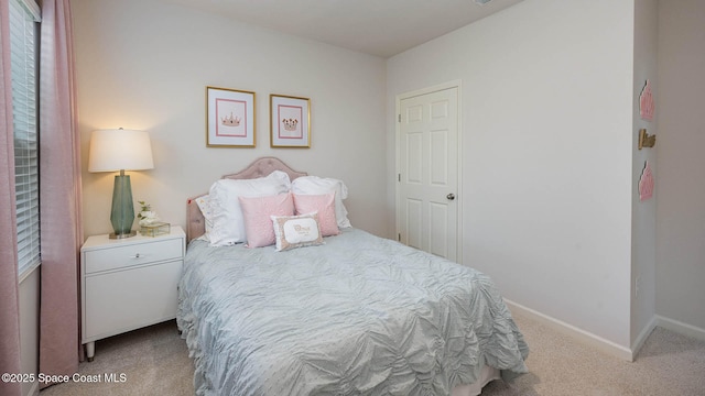 bedroom with carpet flooring and baseboards