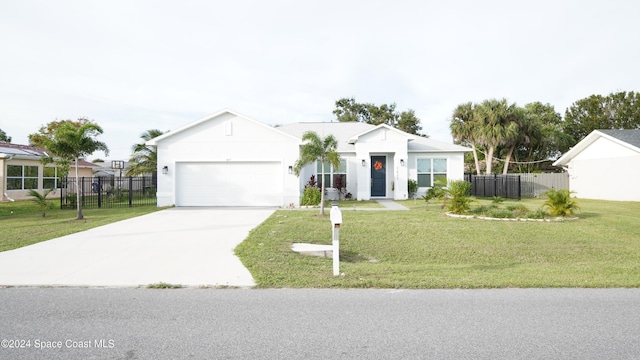 view of front of home featuring a garage and a front lawn