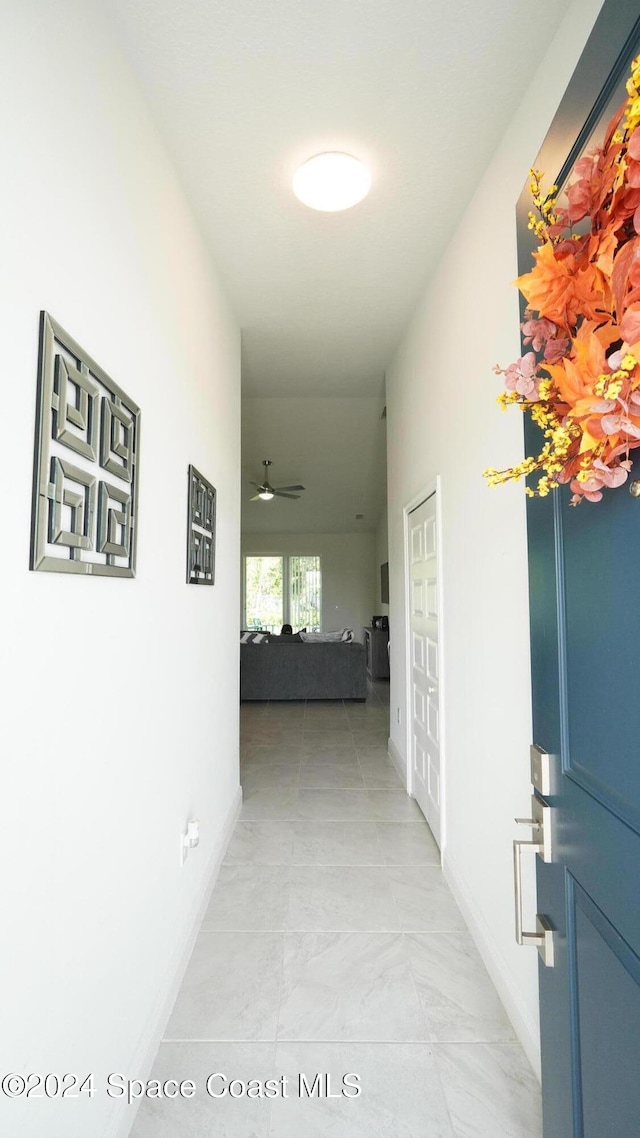 hallway with light tile patterned floors