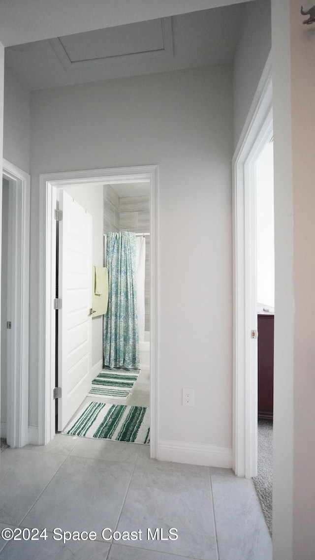 corridor with concrete flooring