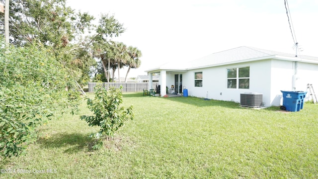 view of yard featuring central air condition unit