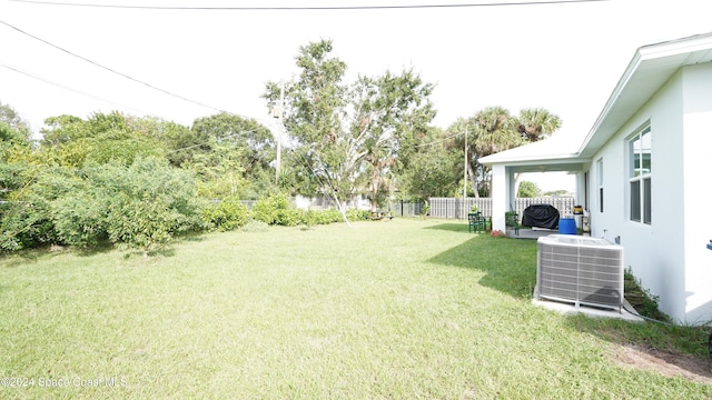 view of yard with central AC