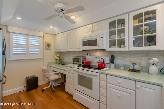 kitchen featuring white cabinetry, ceiling fan, backsplash, white appliances, and light wood-type flooring