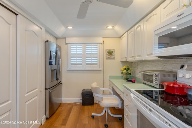 kitchen featuring stainless steel refrigerator with ice dispenser, range with electric cooktop, tasteful backsplash, light hardwood / wood-style floors, and white cabinetry