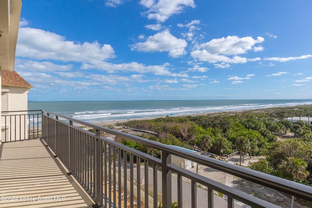 balcony with a beach view and a water view