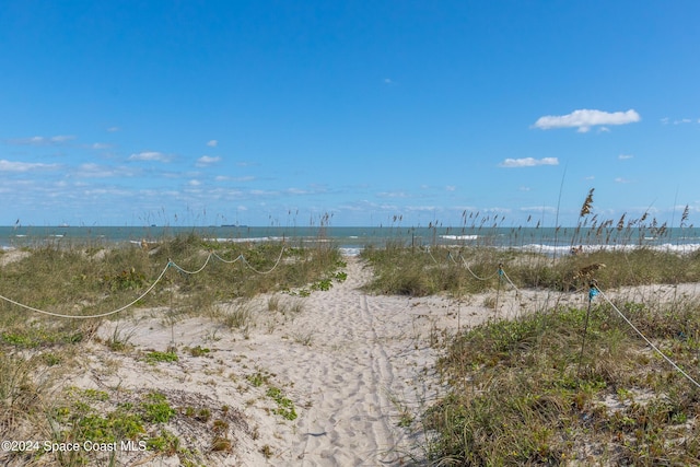 view of water feature with a beach view