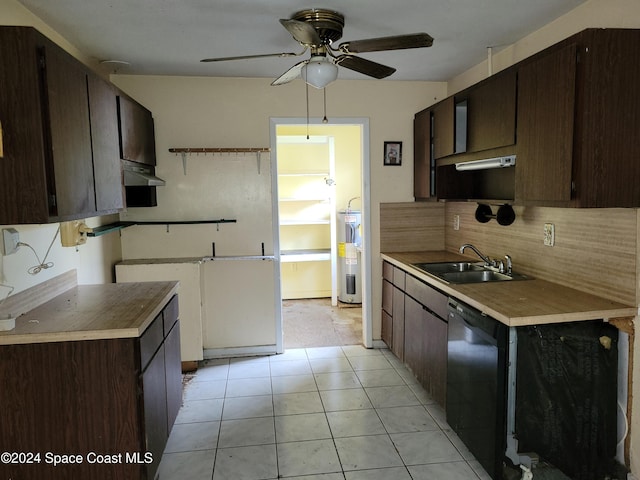 kitchen featuring sink, wall chimney exhaust hood, black dishwasher, electric water heater, and light tile patterned floors