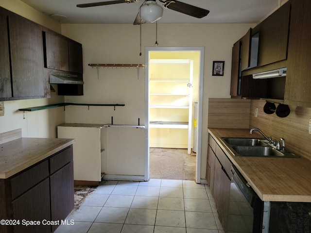 kitchen featuring sink, stainless steel dishwasher, ceiling fan, light tile patterned flooring, and dark brown cabinetry