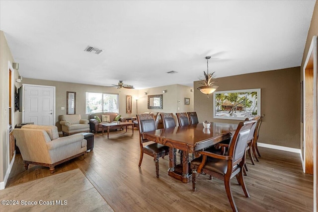 dining area featuring hardwood / wood-style floors and ceiling fan