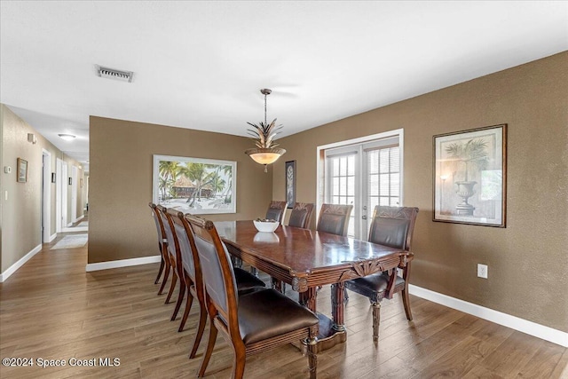 dining space featuring hardwood / wood-style floors