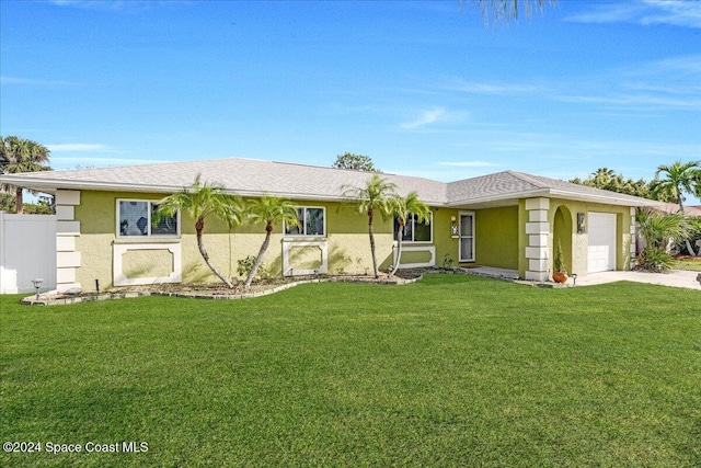 ranch-style house with a front lawn and a garage