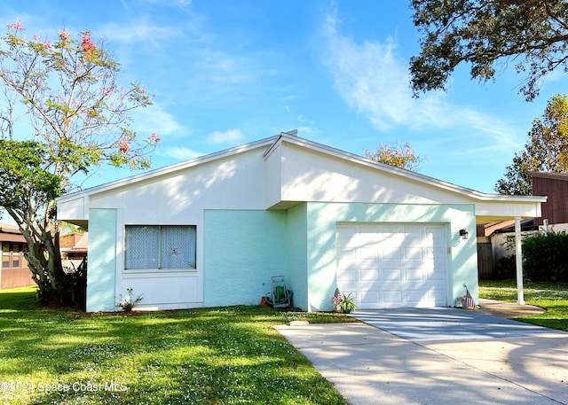 ranch-style home with a front yard and a garage