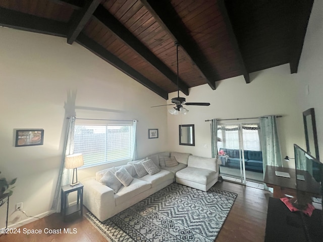 living room with hardwood / wood-style floors, ceiling fan, a wealth of natural light, and beam ceiling