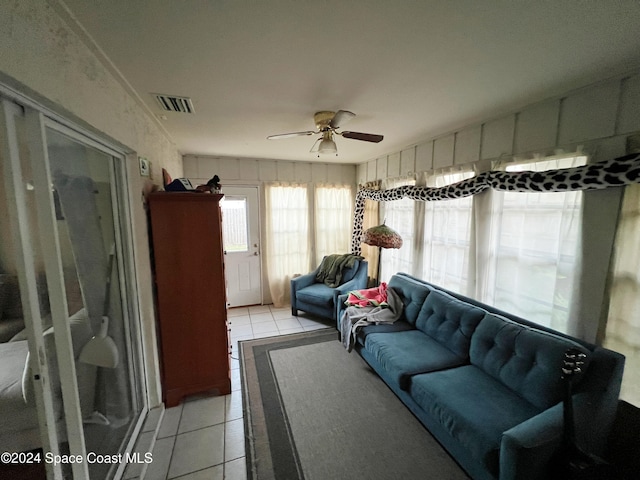 living room featuring ceiling fan and light tile patterned floors