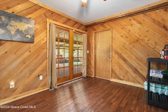 entryway with french doors, hardwood / wood-style flooring, and wooden walls