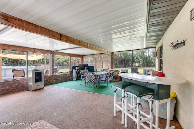 sunroom with beam ceiling