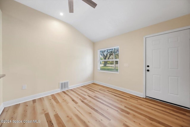 foyer with ceiling fan, light hardwood / wood-style floors, and lofted ceiling