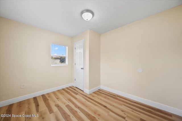 spare room with light hardwood / wood-style flooring